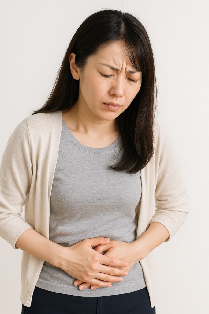 東京都豊島区大塚のおなかとおしりのクリニック 東京大塚の胸焼けを訴えると女性の写真